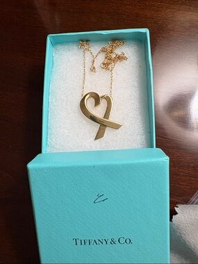 Tiffany & Co. Paloma Picasso 18 Karat gold  “Loving Heart” necklace.